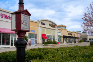 Row of stores at open air shopping center Colony Place in Plymouth, MA